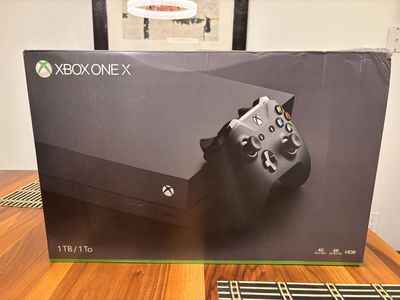 X Box One X w/ 2 controllers & 45 games