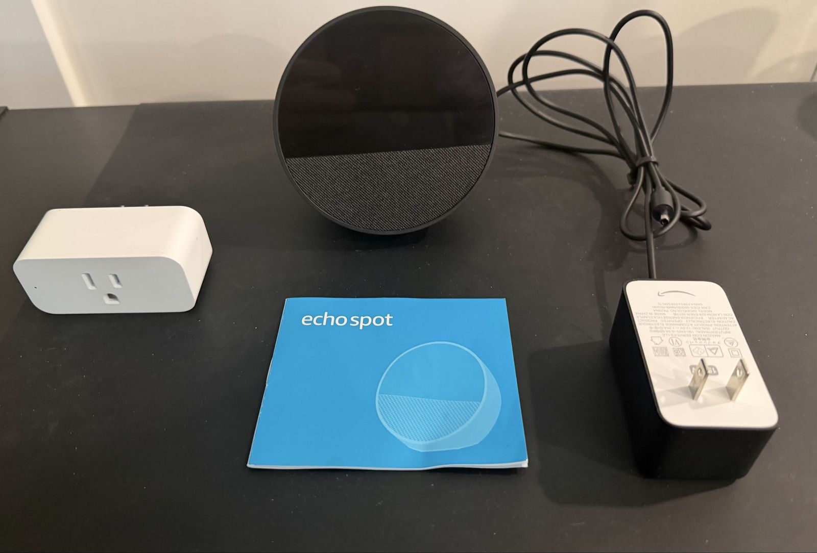 Amazon Echo Spot 2024 release. Smart Alarm Clock Speaker Black with Power Adapter and Smart Plug. Used once.