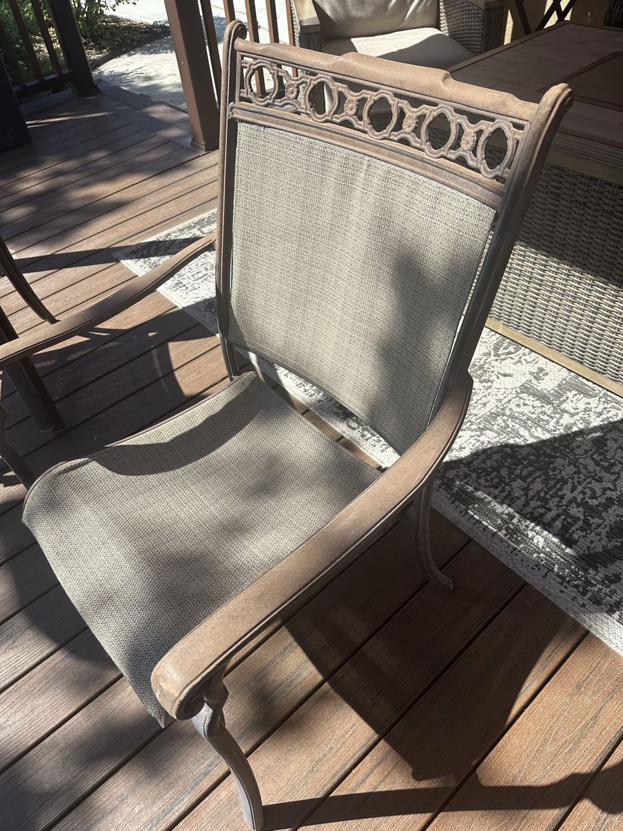 Stackable Sunbrella patio chairs.