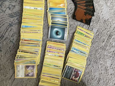 Pokémon Trading Card Game Energy Cards & Sleeves Lot - Mixed Set with Vaporeon Tin