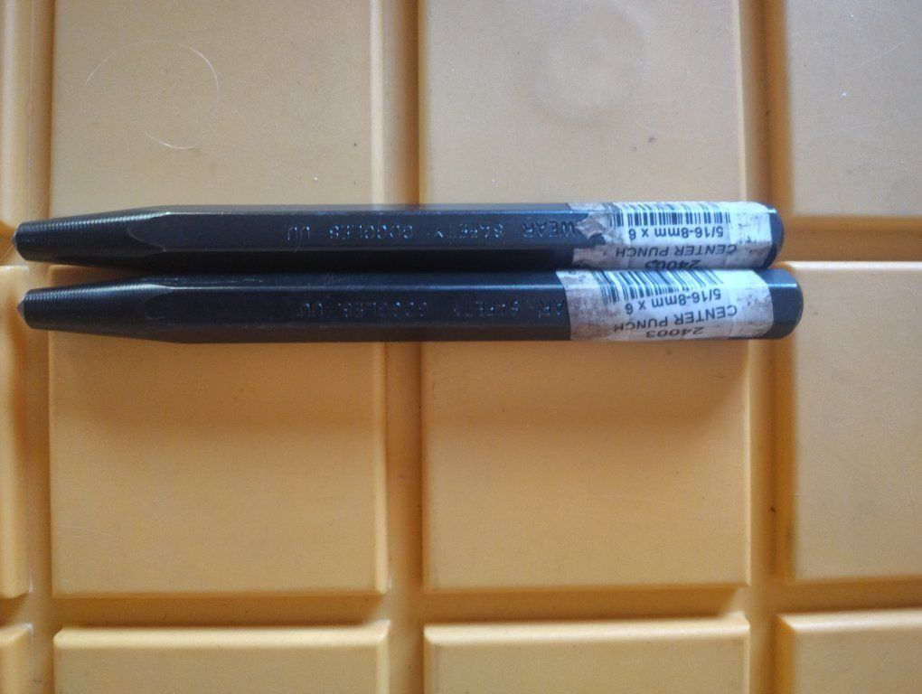 Mayhew center punch.This 5/16-8mm x 6 tool has a hexagonal body and a tapered point.