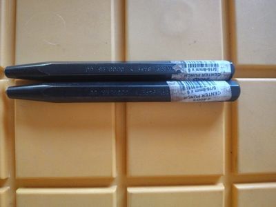 Mayhew center punch.This 5/16-8mm x 6 tool has a hexagonal body and a tapered point.