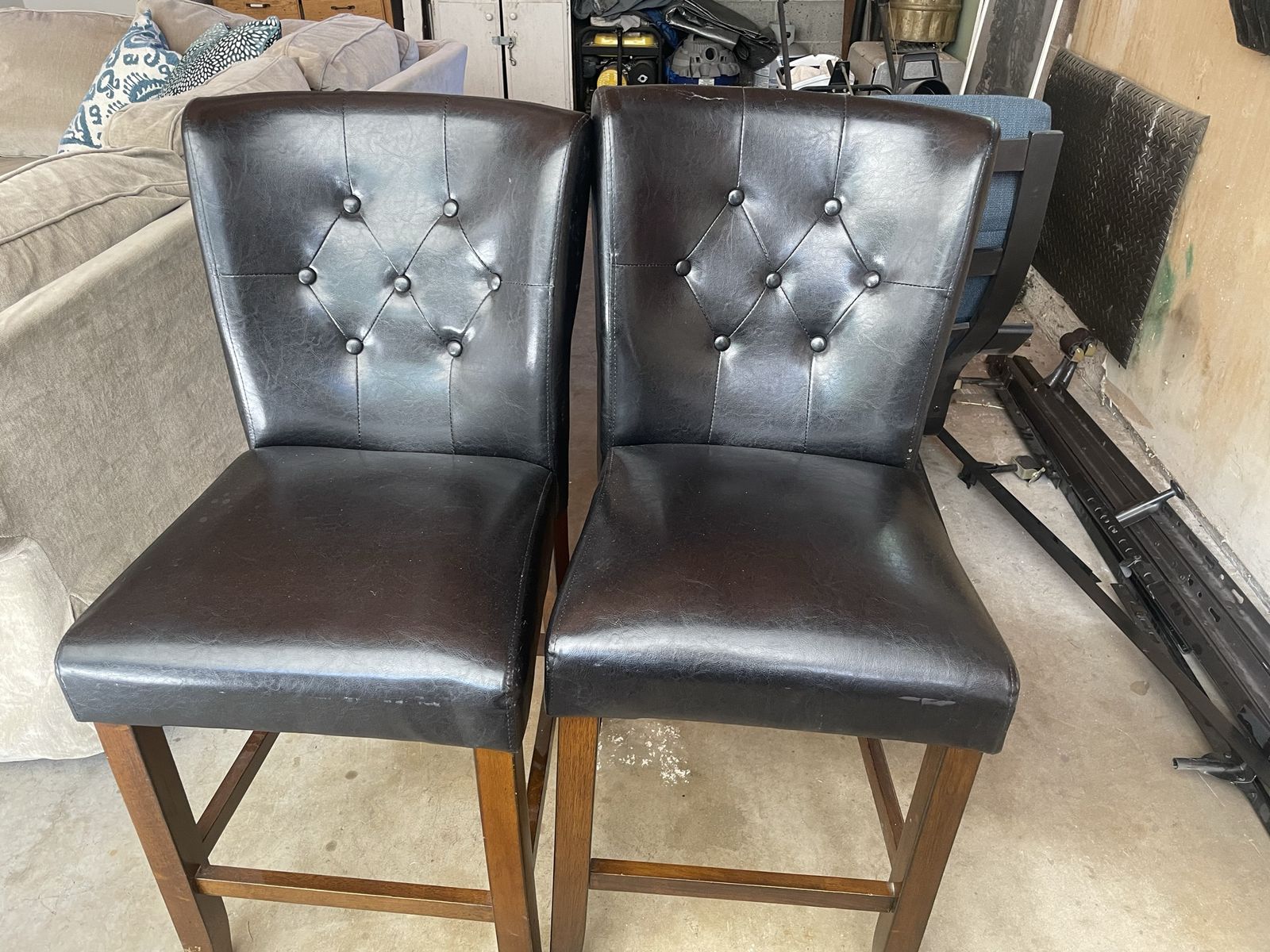 Bar stools black faux leather with chair backs and wooden legs 2 available in great shape