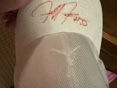 White Jordan hat signed by Michael Jordan’s son Jeffrey Jordan