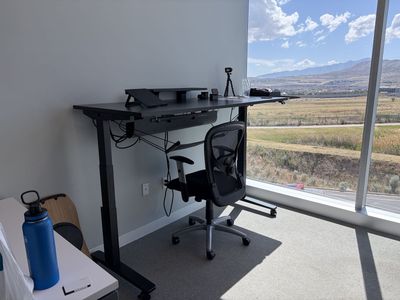 LIKE NEW: UPLIFT Standing Desk with WHEELS and leg hammock / 2025 Sony 50" 4K TV / and chair - $1,500 (or best offer)