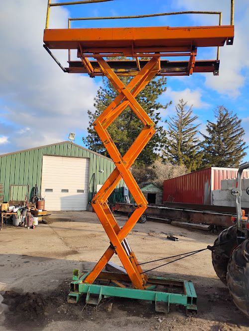 sizzor lift attachment for skid steer