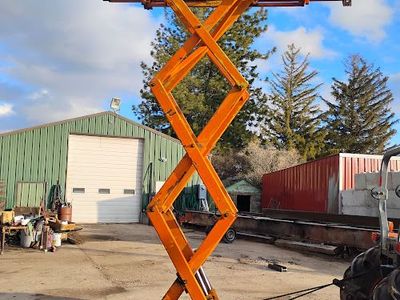 sizzor lift attachment for skid steer