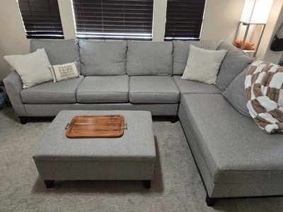 Grey Sectional sofa with matching storage ottoman