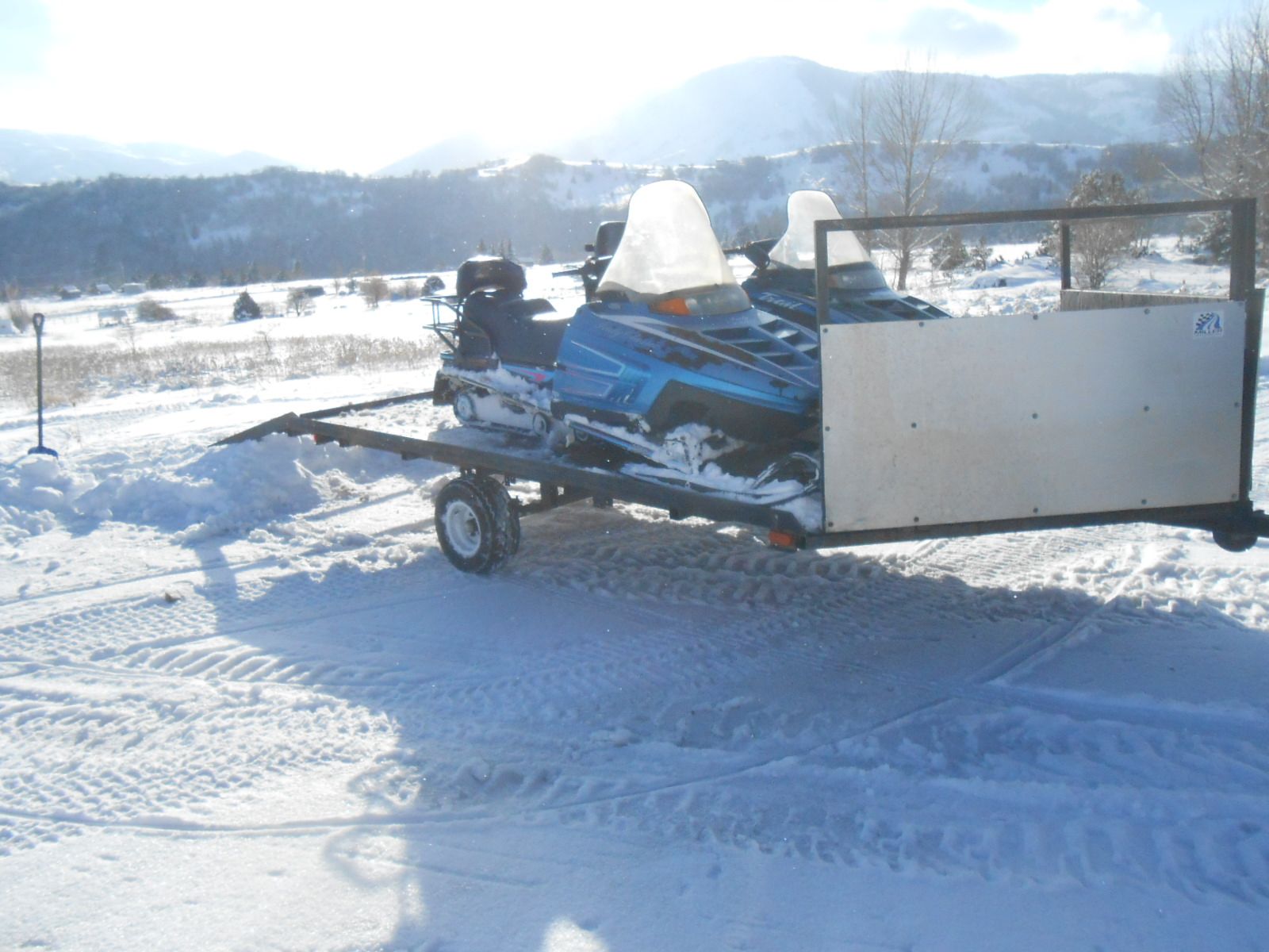 Two Polaris Trail with reverse and trailer.