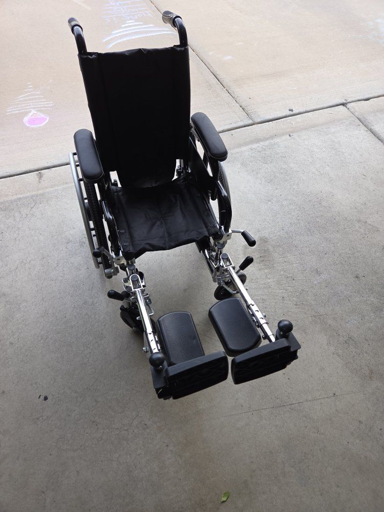 Drive Medical K4 12" Lightweight Black Transport Wheelchair with Footrests
