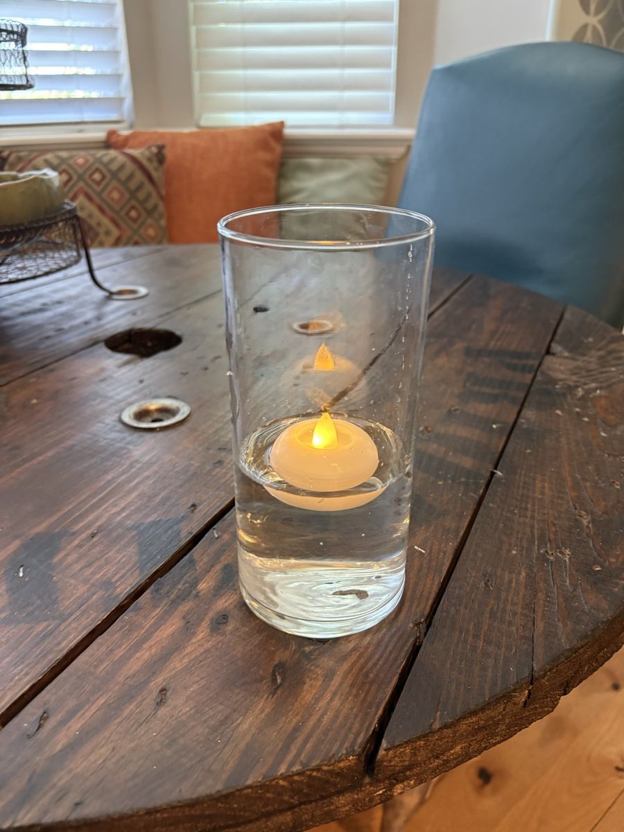 Vase centerpieces with floating tealights