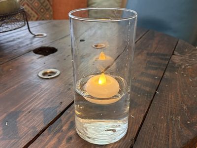 Vase centerpieces with floating tealights