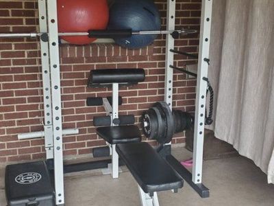 squat rack with weights and bar