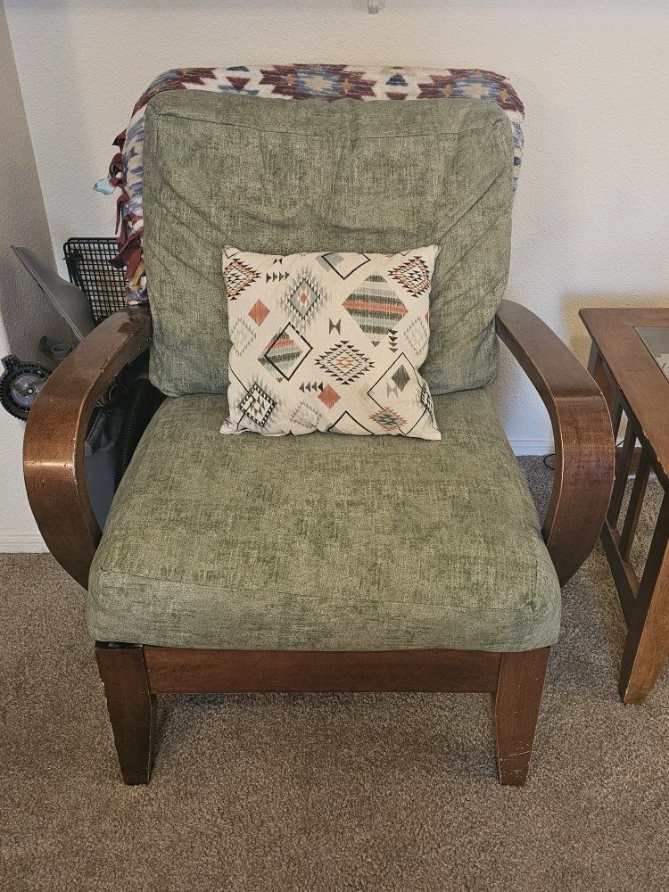 Green Upholstered Armchair with Curved Wooden Frame