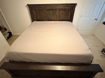 Heavy duty King bedroom set with large dresser and two nightstands that both have power plugins.