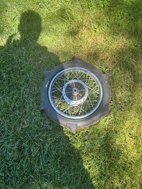 Kawasaki KLX110 rear wheel with paddle tire.  Tire Size 80/100-12