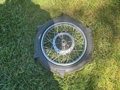 Kawasaki KLX110 rear wheel with paddle tire. Tire Size 80/100-12
