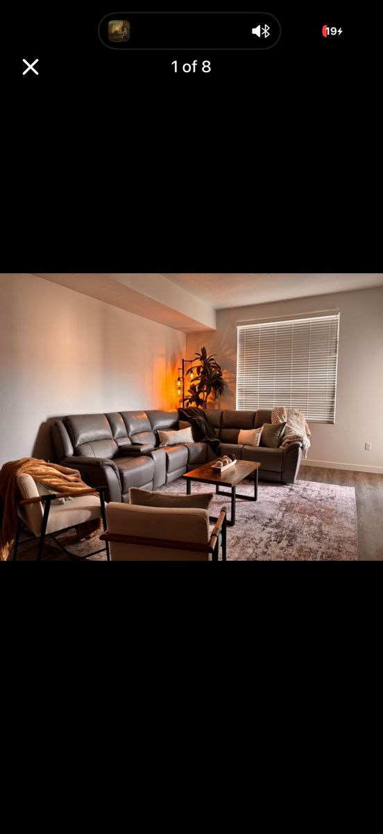 Grey Leather Reclining Couch