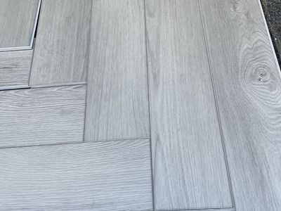 New Light Gray Wood Plank Vinyl Flooring - Multiple Pieces Available 200 square feet herringbone style.