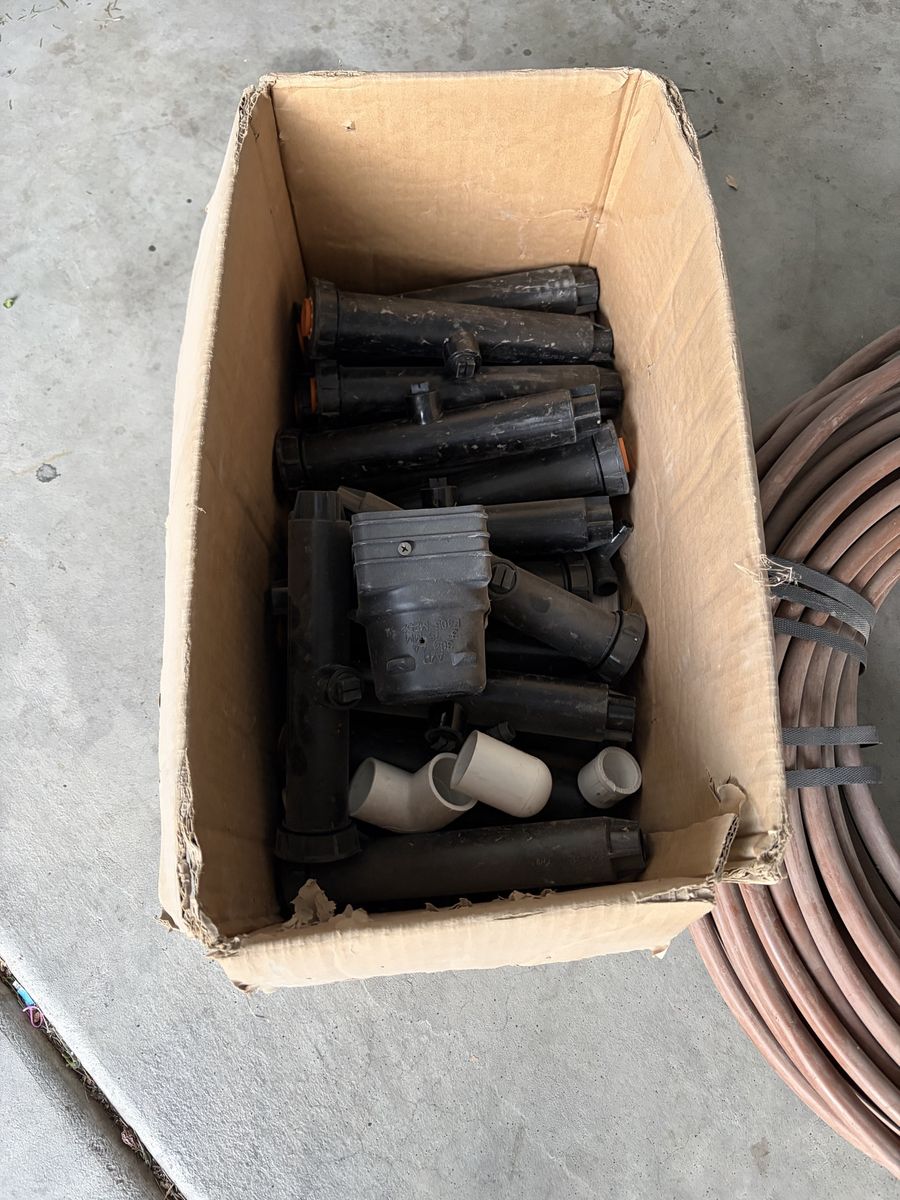Box of sprinklers, and drip hose