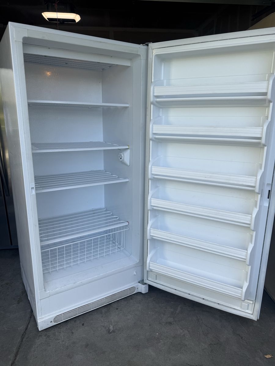 White Upright Freezer with Door Shelves and Wire Baskets works great no longer need $120
