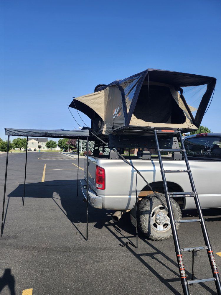 naturnest rooftop tent, hard top with 270 awning and awning enclosure , annex room and truck rack