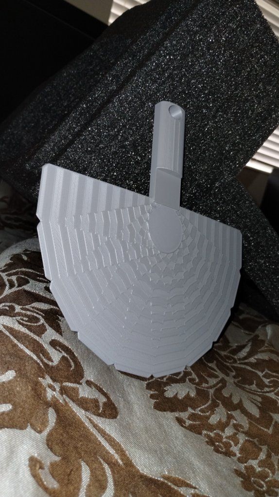 hand fan with wrist strap hole on back