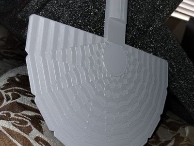 hand fan with wrist strap hole on back