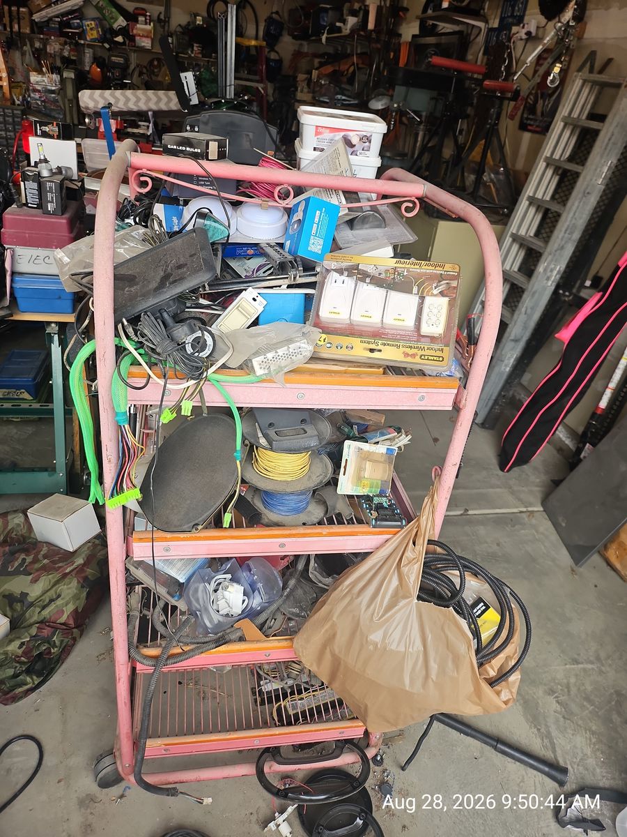 Rack full of assorted Garage Lot of Car Audio Speakers, Wire Nuts, and Hardware