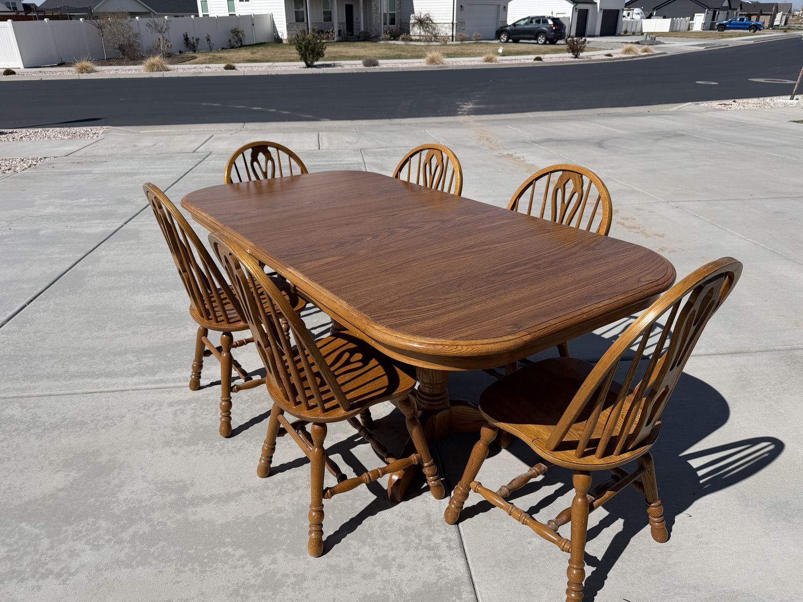 Wooden dining table with 6 spindle back chairs