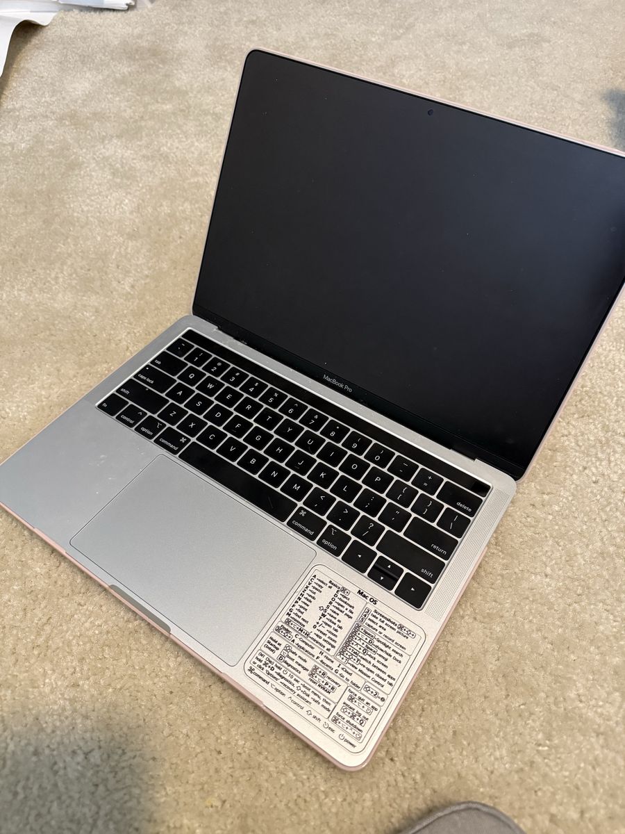 Apple MacBook Pro Laptop with Case and Keyboard Shortcuts Sticker
