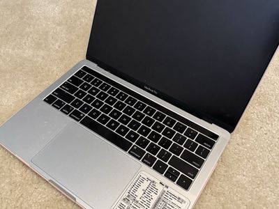 Apple MacBook Pro Laptop with Case and Keyboard Shortcuts Sticker