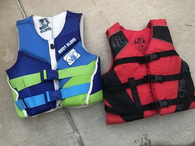 kids 30 to 50 pound life vests 10.00 adult orange vests 2 for 15.00