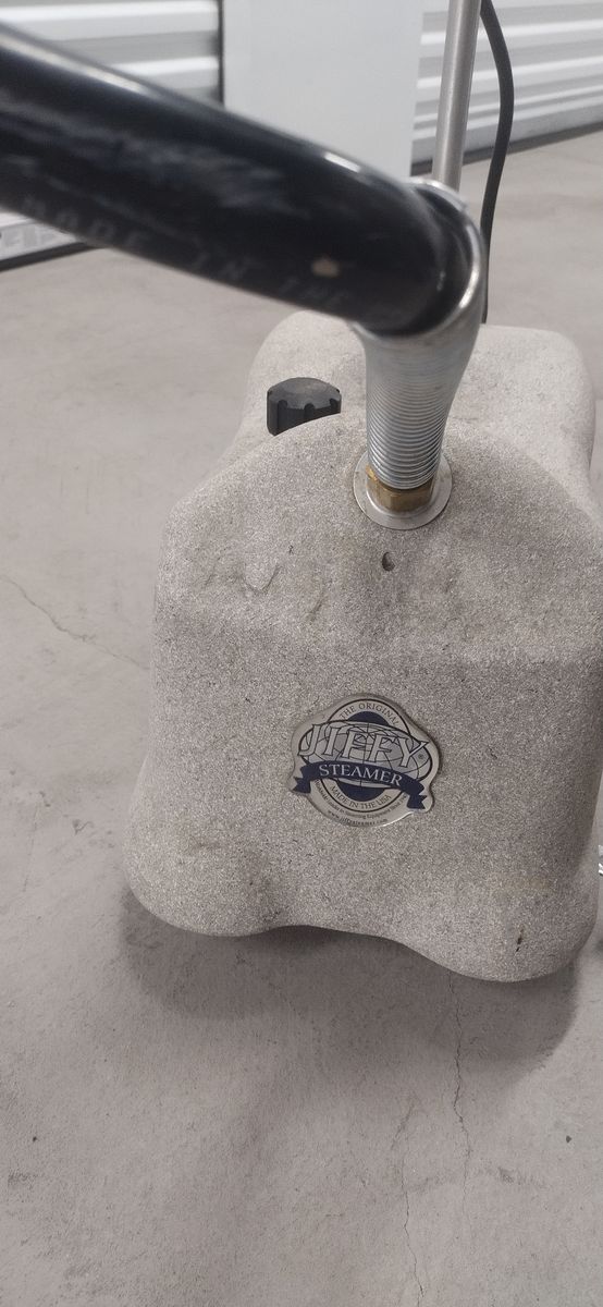 Clothing steamer with a tank for water.