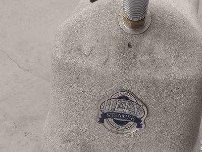 Clothing steamer with a tank for water.