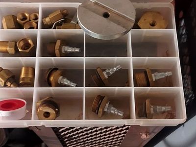 Fire extinguisher recharge kit and hydrostatic test cage