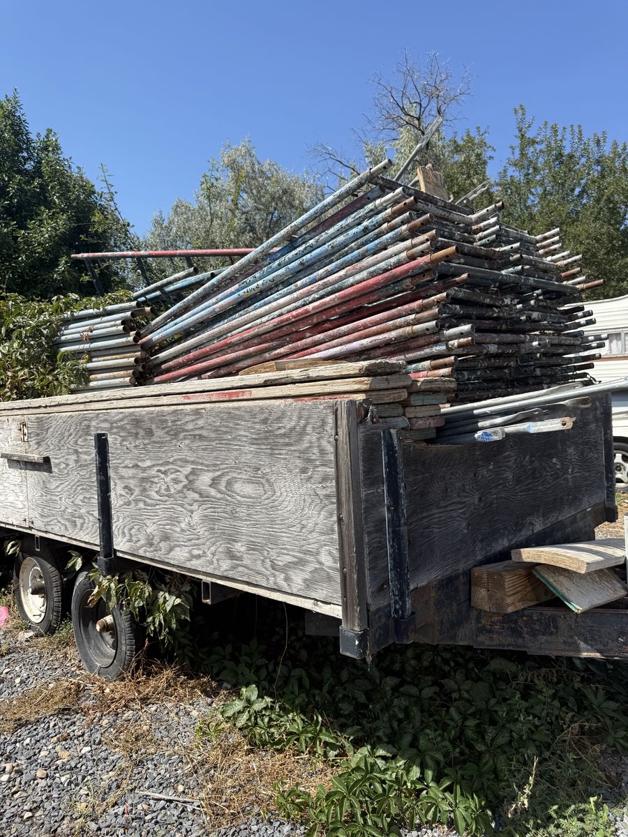 Large Lot of Used Scaffolding Poles and Trailer