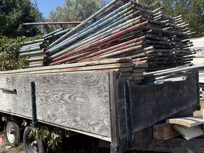 Large Lot of Used Scaffolding Poles and Trailer