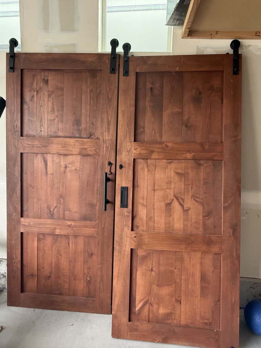 Stained Wood Sliding Barn Doors with Black Hardware