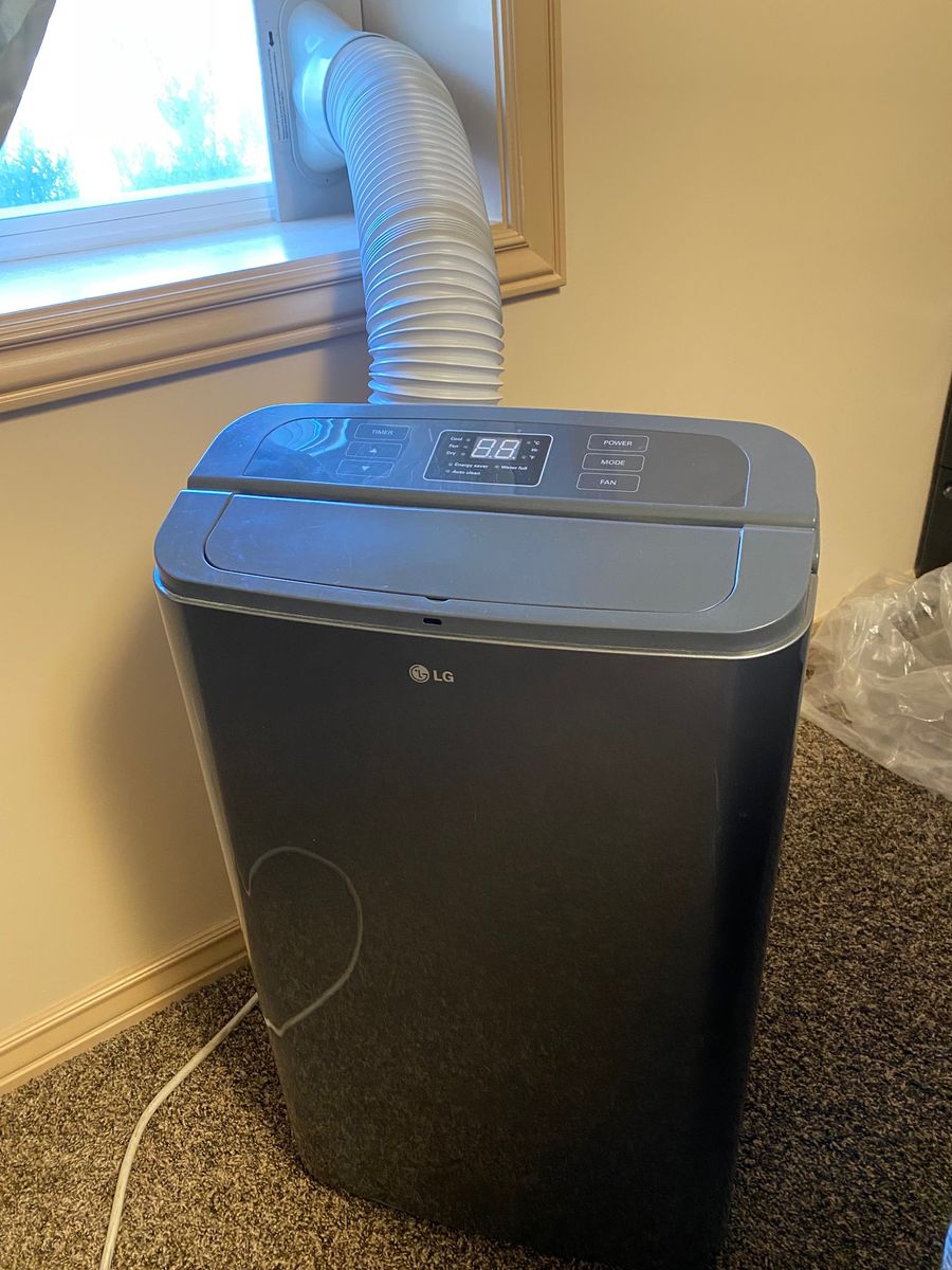 12000 BTU LG Portable Air Conditioner, with Dehumidification, very cold, comes with window vent,