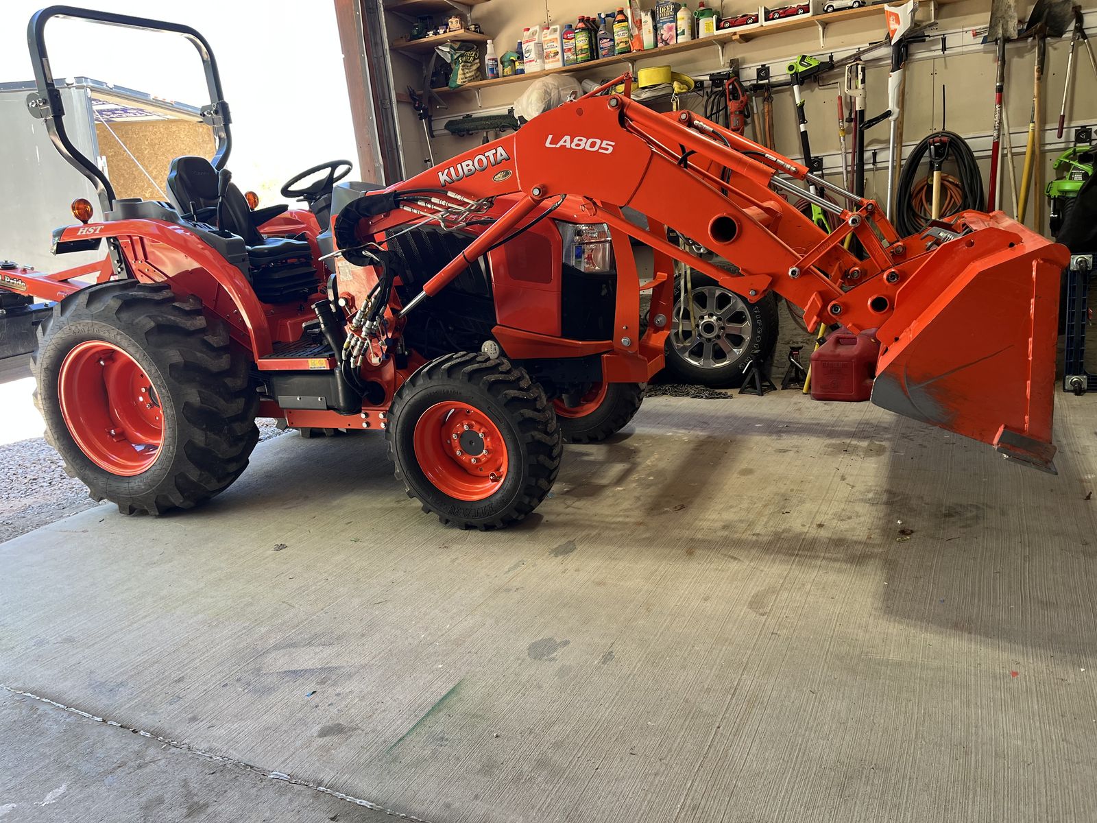 Kubota tractor with implements, and heavy duty tilt bed, equipment trailer.