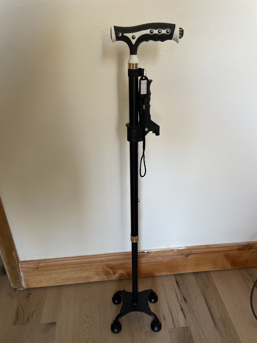 Adjustable walking cane w / flashlight