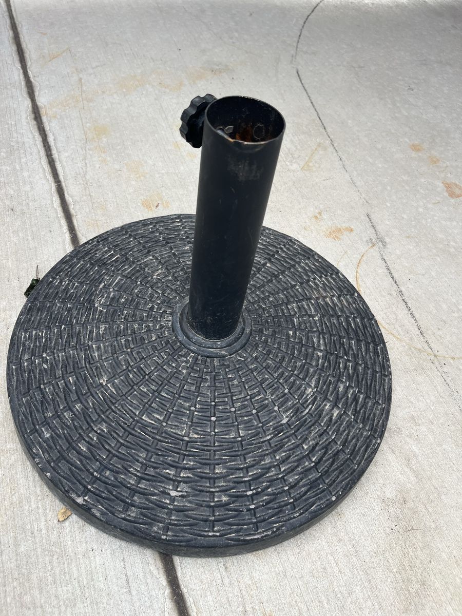 Umbrella stand heavy and very sturdy.