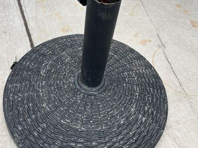 Umbrella stand heavy and very sturdy.