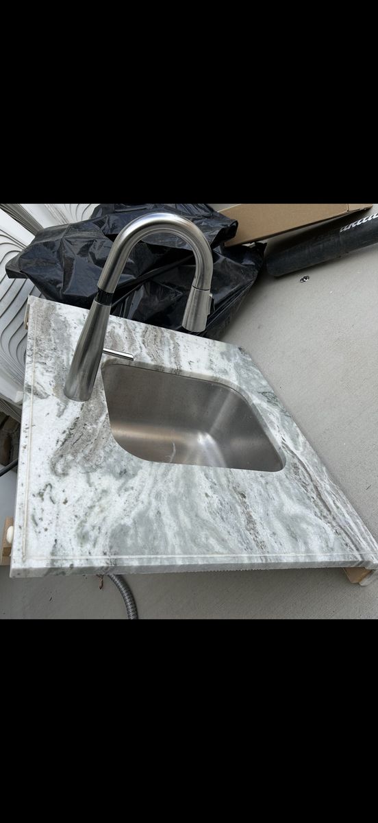 Gray & White Marble Style Countertop with Stainless Steel Sink and Faucet