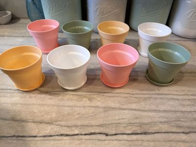 8 four inch plastic planter pots