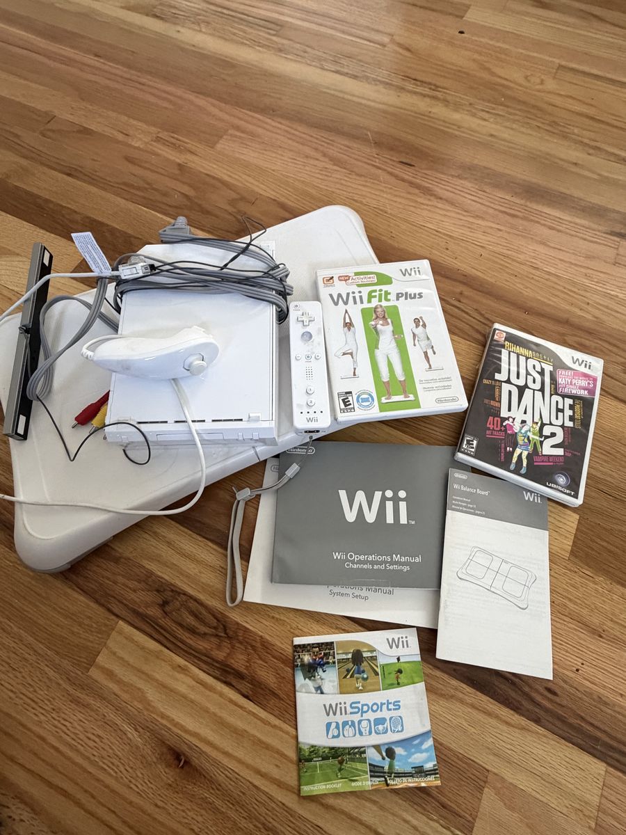 Nintendo Wii Console Bundle with Wii Fit Board and Games