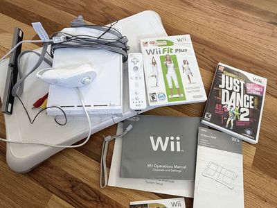 Nintendo Wii Console Bundle with Wii Fit Board and Games
