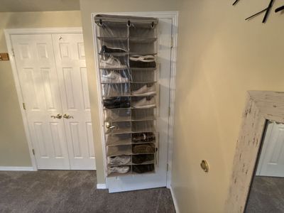 Shoe organizer hanging behind door