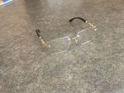 Luxury Rimless Clear Lens Glasses with Gold Temple Detail